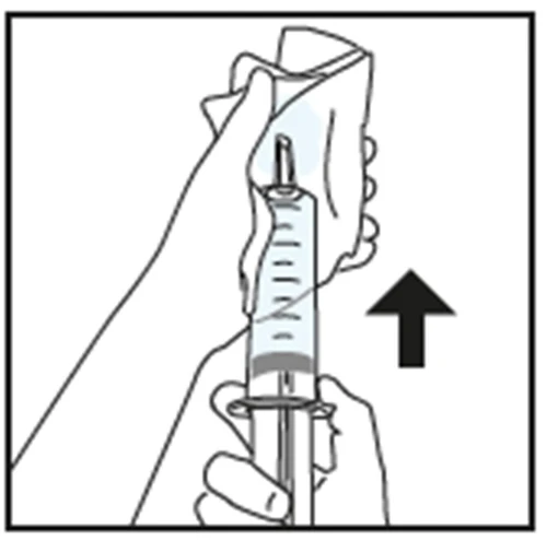 Two hands holding a syringe with needle pointing upward