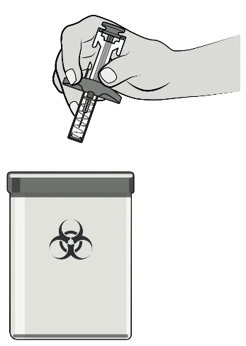 A hand holding a syringe ready for