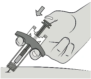 A hand holding a syringe with a gray safety device while an arrow indicates the downward pressing motion