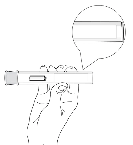 Una mano sostiene horizontalmente un dispositivo médico cilíndrico con un aumento circular que muestra el detalle de la ventana de control