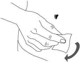 A hand holding a cloth and rubbing it in a rotational motion over a portion of the body's skin