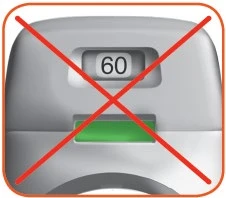 Gray medical device with a digital display reading 60 and a green window below, with a large red cross above