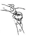 A hand holding a bottle to instill eye drops while the