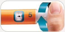A finger pressing on an orange medical device with number 5 and a black arrow to rotate a blue part counterclockwise