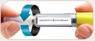 Two hands holding a transparent syringe with a curved blue arrow indicating rotational movement for unscrewing