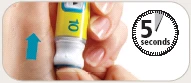 A hand holding a yellow and white medical device against the skin with a blue arrow pointing upward