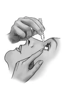 Two hands carefully applying a drop of liquid into the eye