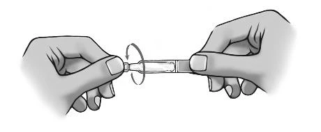 Two hands holding an injection pen and rotating the top to prepare the drug dosage