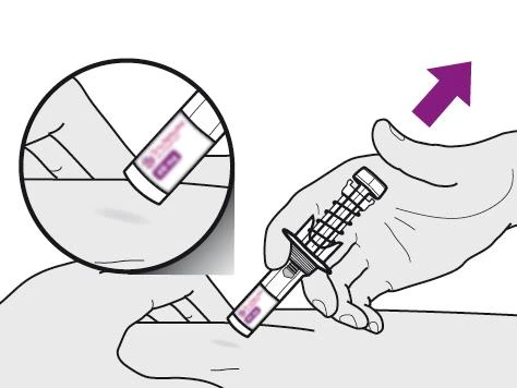 A hand holds a pre-filled syringe ready for injection