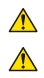 Two identical warning symbols consisting of a yellow triangle with black border and a black exclamation mark at the center