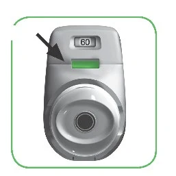 Gray medical device with a digital display reading 60 and a horizontal green bar indicated by a black arrow pointing downward