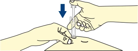 A hand holds a transparent syringe and pushes it vertically downward into the skin while the other hand stabilizes the area