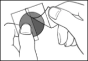Two hands holding and separating two overlapping transparent sheets containing a dark circle in the center