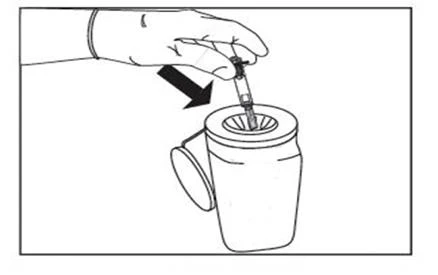 A hand inserts a syringe with needle into a
