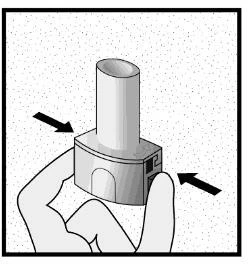 A hand holds an inhaler with two black arrows indicating to press the sides of the device for the