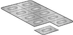 A metallic blister pack with eight oval compartments for pills and one single separate cell in the foreground on a white background