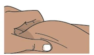 Two hands gently pressing the skin of the abdominal area to prepare the