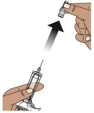 A hand lifts a protective cap upward toward the