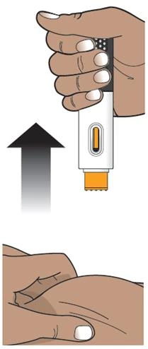 A hand holds a black and white medical device with a black arrow pointing toward the