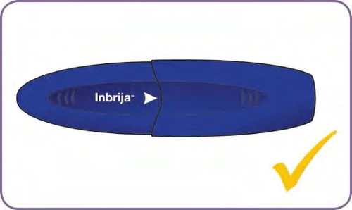 Dispositivo médico azul de forma ovalada con la inscripción Inbrija y una marca de verificación amarilla en la esquina inferior derecha sobre fondo blanco