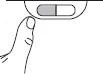 A finger presses the button of an oval medical device with a gray and a white section to activate the mechanism