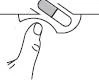 Line drawing of a hand pressing the button of a capsule-shaped medical device for the