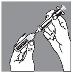 Two hands hold a syringe and a vial to draw liquid through the