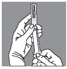 Two hands hold a syringe with the needle pointing toward the