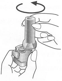 Two hands hold a cylindrical medical device while a curved arrow indicates a rotational movement to the left