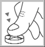 A finger pressing firmly downward on a small flat circular device with arrows indicating the direction of pressure