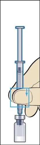 A hand holds a syringe vertically while pushing the plunger downward to draw liquid from an underlying glass vial