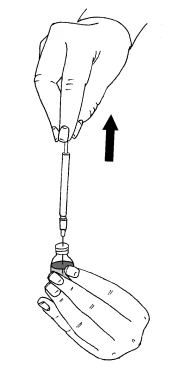 A hand holds a syringe vertically and inserts it into a glass vial held with the