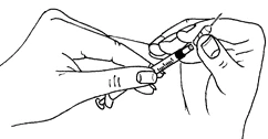 Two hands holding and preparing a syringe with a needle for