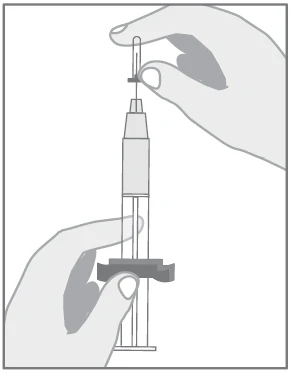 A hand holds the top part of a syringe while the
