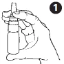 A hand holds vertically a cylindrical medical device with fingers wrapped around the body of the