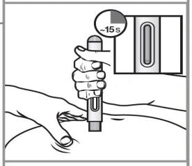A hand holding a medical device for administration