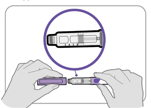 Two hands holding and connecting two parts of a medical device for administration