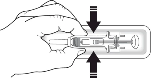 A hand holding a horizontal medical device with two black arrows indicating pressure toward the center of the device