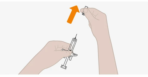 Hands removing the upper cap from a syringe with an upward motion