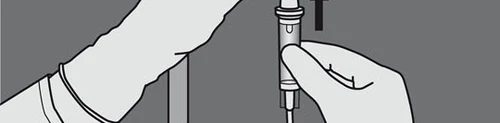 A hand gripping a medical pen device vertically while the