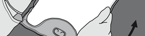 Hands lifting the edge of a gray circular medical device to reveal its underside with two small central holes