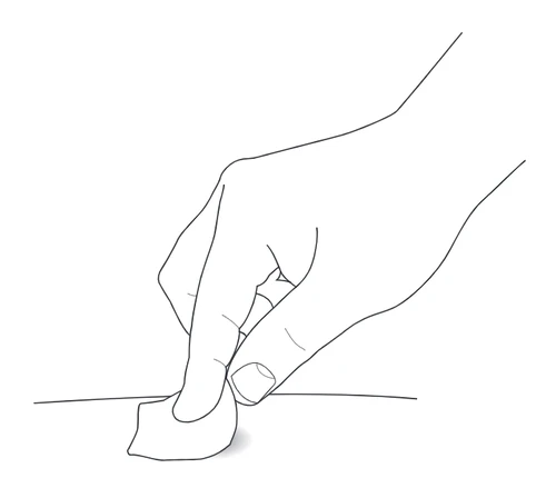 Black line drawing showing a hand pressing a cotton ball or gauze pad onto a flat surface