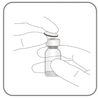 Two hands hold a glass vial while one hand removes the metal cap on top to access the contents