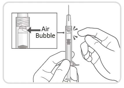 Technical drawing of a syringe held between two hands with a magnified view showing an air bubble in the barrel