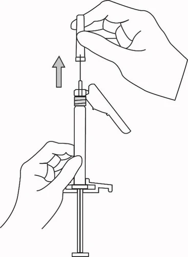 One hand holding a cap while the