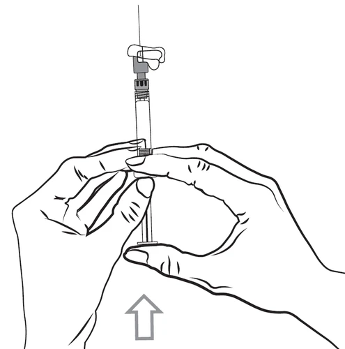 Two hands hold a syringe with needle pointing upward