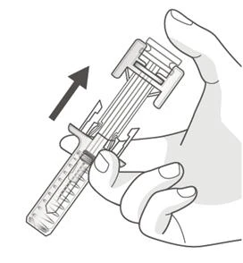 A hand holds a syringe with a