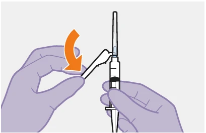 Two gloved hands manipulating a syringe while one hand rotates a white cap downward, indicated by an orange curved arrow