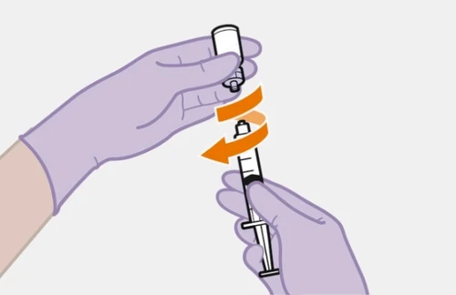 Two gloved hands rotating a white cap on a syringe with an orange curved arrow indicating counterclockwise rotational movement