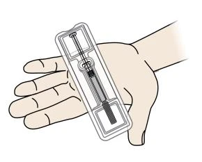 Una mano sostiene una jeringa precargada con aguja insertada en una blíster transparente para la administración del fármaco